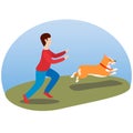 A man walking his dog. Happy cute dog. Welsh Corgi. Puppy fun runs, sticking out his tongue Royalty Free Stock Photo