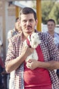 Man walking with his sweet white rabbit