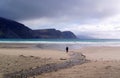 Man walking on the Keel Beach in Achill Island, County Mayo, Ireland Royalty Free Stock Photo