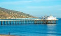 Man walking by Malibu pier at dusk Royalty Free Stock Photo