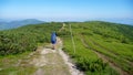 Man walking in hills on path with big bag in tatra mountains