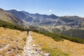 Man walking mountains trail. Royalty Free Stock Photo