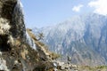 Man Walking by Mountainside Waterfall Royalty Free Stock Photo