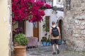 Man Walking Through Narrow Streets of Old Town Rhodes