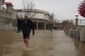 Man walking through Ohio River flood 2018 Royalty Free Stock Photo