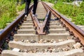 A man walking on old rusty railway tracks outdoors Royalty Free Stock Photo