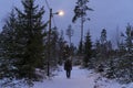 Man walking outdoors at winter in Swedish forest