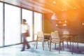 Man walking in panoramic gray dining room Royalty Free Stock Photo