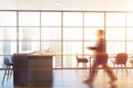 Man walking in panoramic kitchen with grey bar Royalty Free Stock Photo