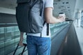 Man walking with paper coffee cup at airport terminal Royalty Free Stock Photo