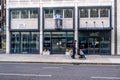 Man Walking Past Empty Offices To Rent With Two Young Daughters And A Baby Stroller In Victoria Street London