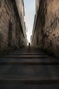 A man walking right up the long stairs Royalty Free Stock Photo