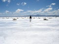 Man walking in a salt field