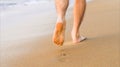 Man walking on sea, footprint on sandy beach Royalty Free Stock Photo