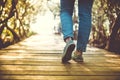 Man is walking on small wood bridge to nature walk way Royalty Free Stock Photo