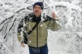 Man Walking through Snow Filled Branches 2