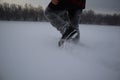 Man walking in snow. shoes close up