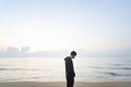 Man walking in solitude at the beach Royalty Free Stock Photo