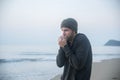 Man walking in solitude at the beach Royalty Free Stock Photo