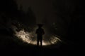 man walking in spooky forest at night Royalty Free Stock Photo