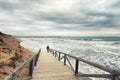 Man walking in stormy day. See swell Royalty Free Stock Photo