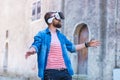 Man walking in the street in augmented reality headset. Virtual reality and futuristic technology concept.