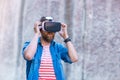 Man walking in the street in augmented reality headset. Virtual reality and futuristic technology concept.