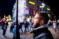 Man walking in the streets of London at night Royalty Free Stock Photo