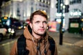 Man walking in the streets of London at night Royalty Free Stock Photo