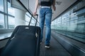 Man walking with suitcase at airport terminal Royalty Free Stock Photo
