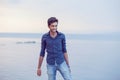 Man walking thoughtful blue sky and sea on background