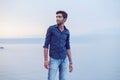 Man walking thoughtful blue sky and sea on background