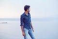 Man walking thoughtful blue sky and sea on background