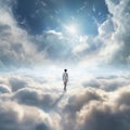 man walking towards the light on a path of clouds in a dreamy sky Royalty Free Stock Photo