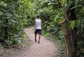 Man walking on trail at `Bosque da Freguesia` Public park in the neighborhood of Jacarepagua Royalty Free Stock Photo