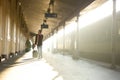 Man walking at train station calling by mobile phone Royalty Free Stock Photo