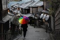 Man walking in umbrella area in Higashiyama Known as Ninen-zaka, it is Kyoto`s distinctive street, especially between Royalty Free Stock Photo