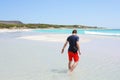 Man walking through water Royalty Free Stock Photo