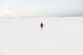 Man walking at White Sands National Monument in Alamogordo, New Mexico.