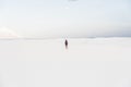 Man walking at White Sands National Monument in Alamogordo, New Mexico. Royalty Free Stock Photo