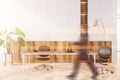 Man walking in white and wooden home office Royalty Free Stock Photo