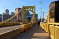 A man walks across the Roberto Clemente Bridge Royalty Free Stock Photo