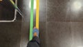 POV shot of a man walking along hospital wayfinding floor markings Radiology and Physiotherapy