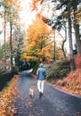 Man walks with beagle dog in rainy autumn day Royalty Free Stock Photo
