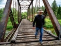 Man walks a cross a bridge with motion blur Royalty Free Stock Photo