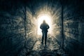 The man walks down the tunnel towards the light Royalty Free Stock Photo