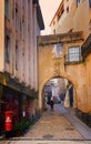 Man walks his dog in the allies of Coimbra Portugal Royalty Free Stock Photo