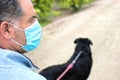 A man walks with his dog outdoors after Spain imposed a lockdown to slow down the spread of the coronavirus disease in Murcia,