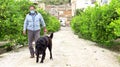 A man walks with his dog outdoors after Spain imposed a lockdown to slow down the spread of the coronavirus disease in Murcia,