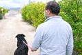 A man walks with his dog outdoors after Spain imposed a lockdown to slow down the spread of the coronavirus disease in Murcia,